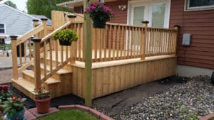 Large custom-built light wooden porch and steps