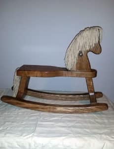 Custom-made wooden children’s rocking horse
