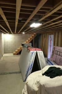 Unfinished basement with exposed ceiling & cement floor