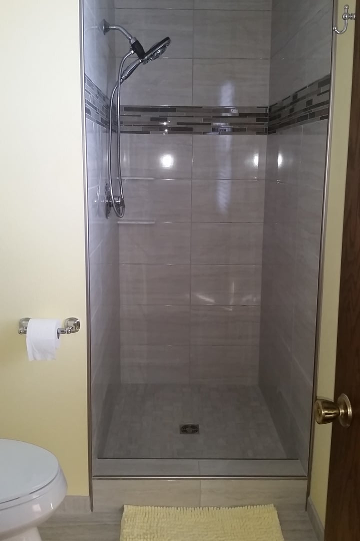 Updated ‘after’ photo of open shower with large tiles