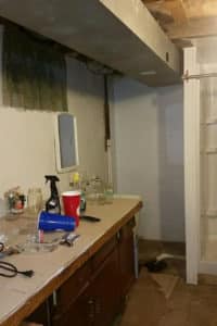 Messy, unfinished basement bathroom ‘before’ picture