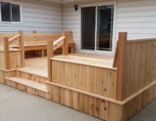 Large light wooden deck with built-in bench & steps