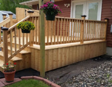 Large custom-built light wooden porch and steps