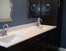 Master bathroom remodel with dark cabinets, blue walls & modern fixtures