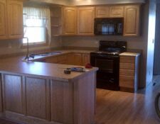 Custom wooden cabinetry in a u-shaped kitchen