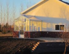 Greenhouse addition constructed on the side of a house