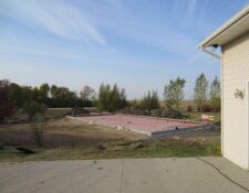 Large, rectangular concrete foundation being built