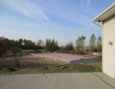 Large, rectangular concrete foundation being built