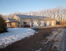 Exterior of a cream-colored 4-stall workshop