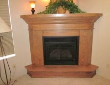 Custom-built corner oak fireplace surround