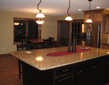 Granite island on dark cabinets